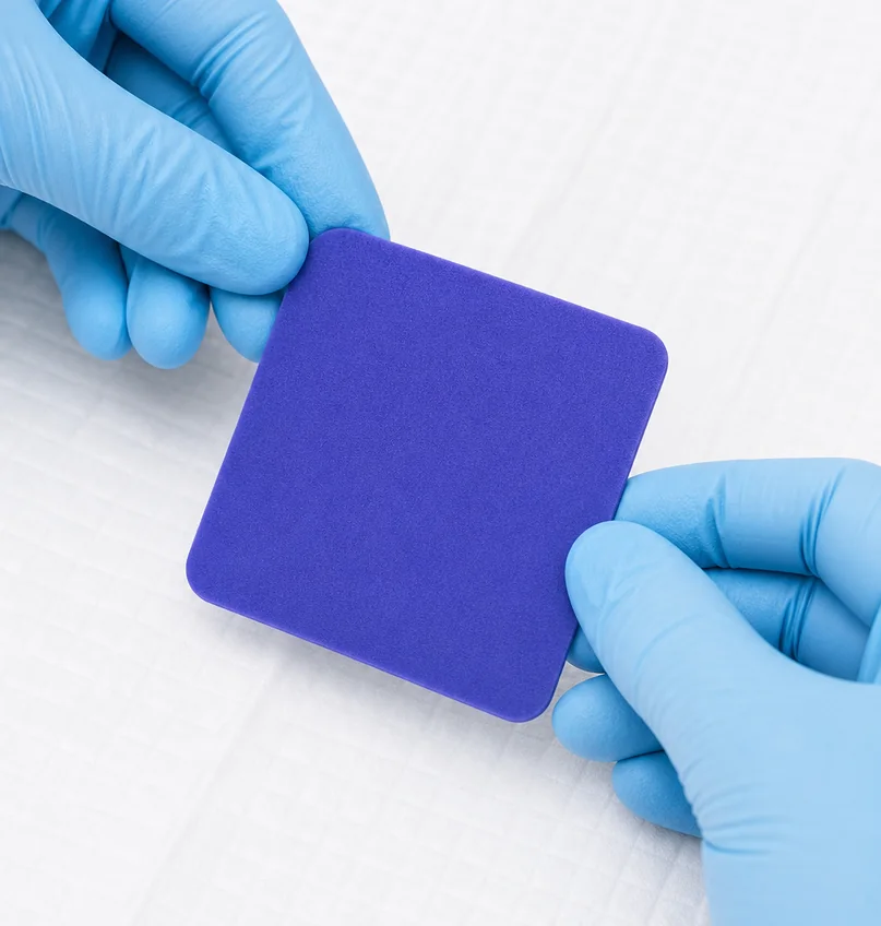 Hydrofera Blue READY dressing shown with a measurement scale