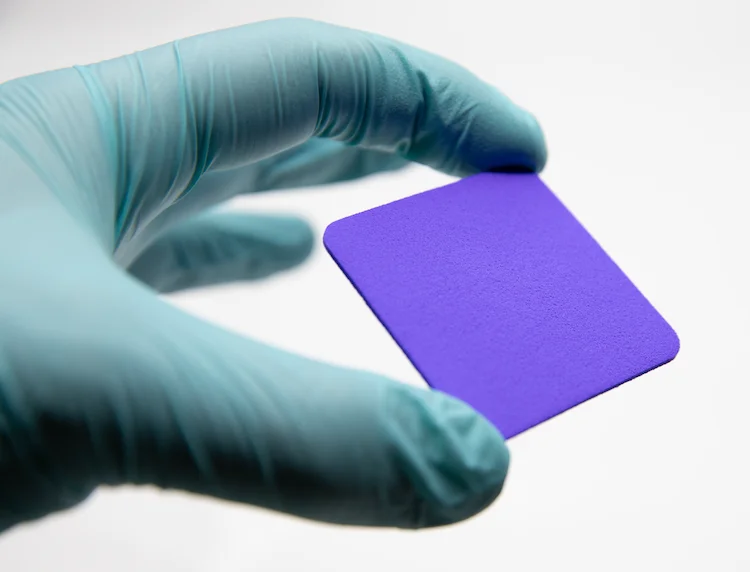 Clinician holding a Hydrofera Blue CLASSIC antibacterial foam dressing